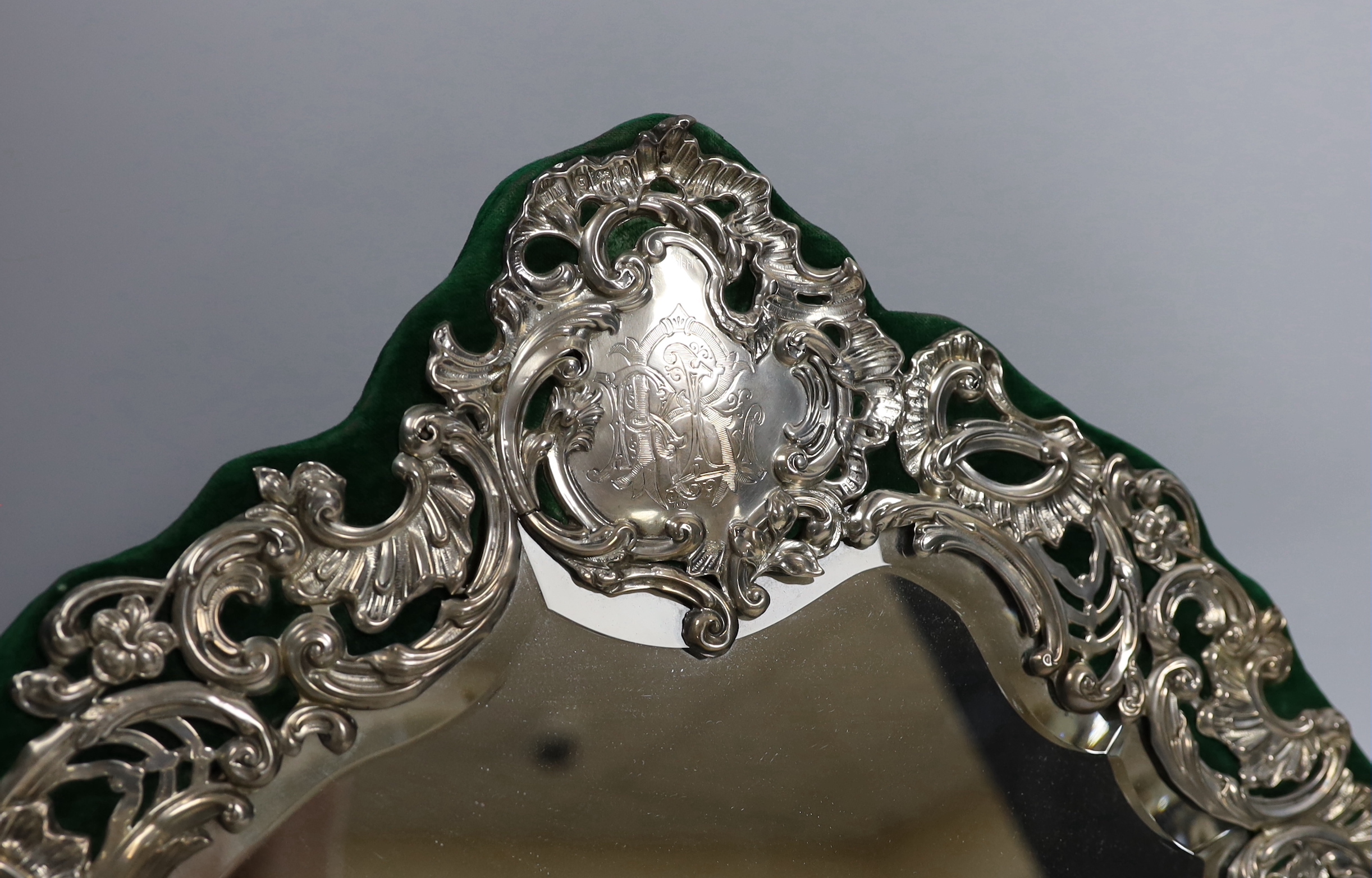 An ornate Edwardian silver mounted easel dressing table mirror, Henry Matthews, Birmingham, 1902, height 35cm.